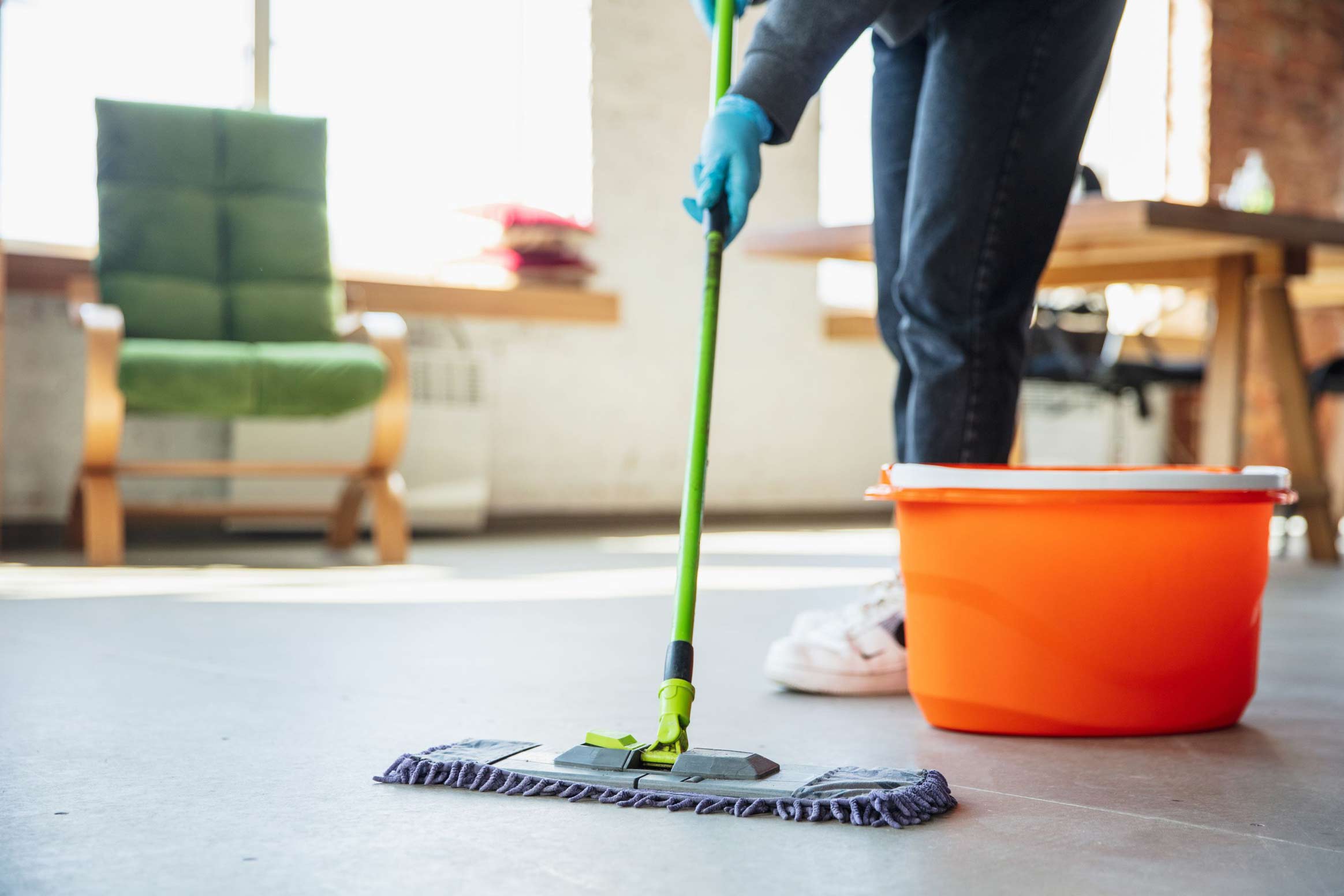 Person Cleaning The Floor with Eco-friendly Product