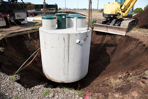 Environmentally friendly septic tank being lowered into ground