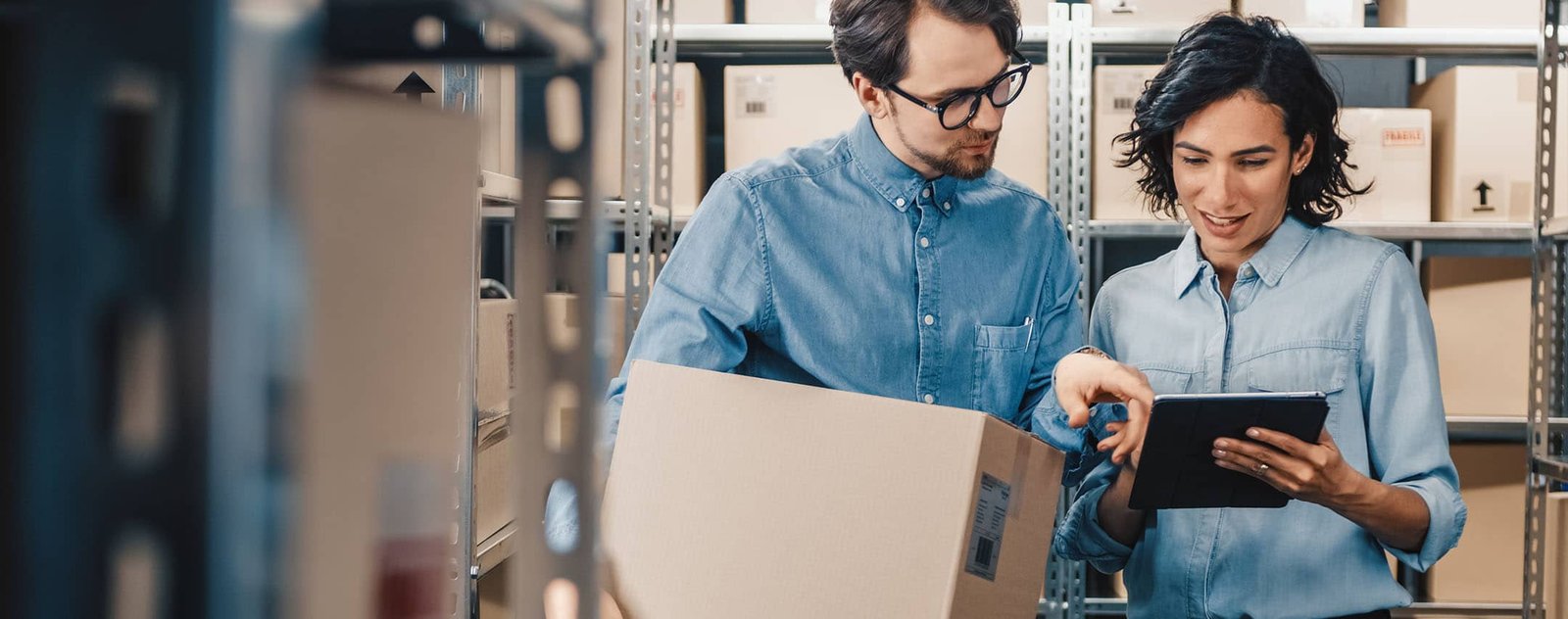 supplier data synchronization - gentleman and woman looking at a tablet