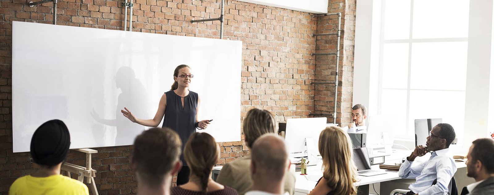 Woman holding a training session for her employees
