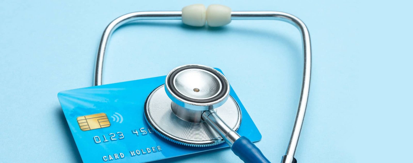 Automate credit review | stethoscope laying on a credit card