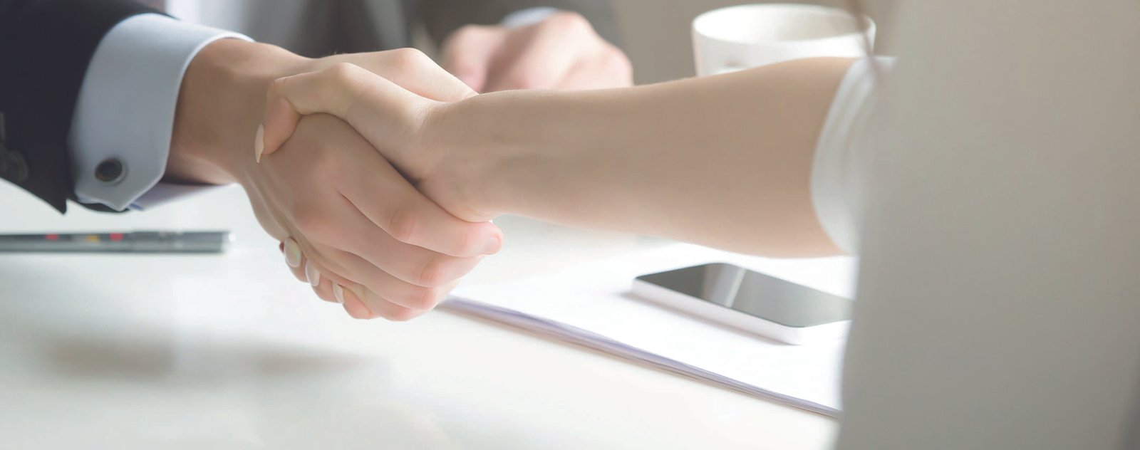 close up of two people shaking hands