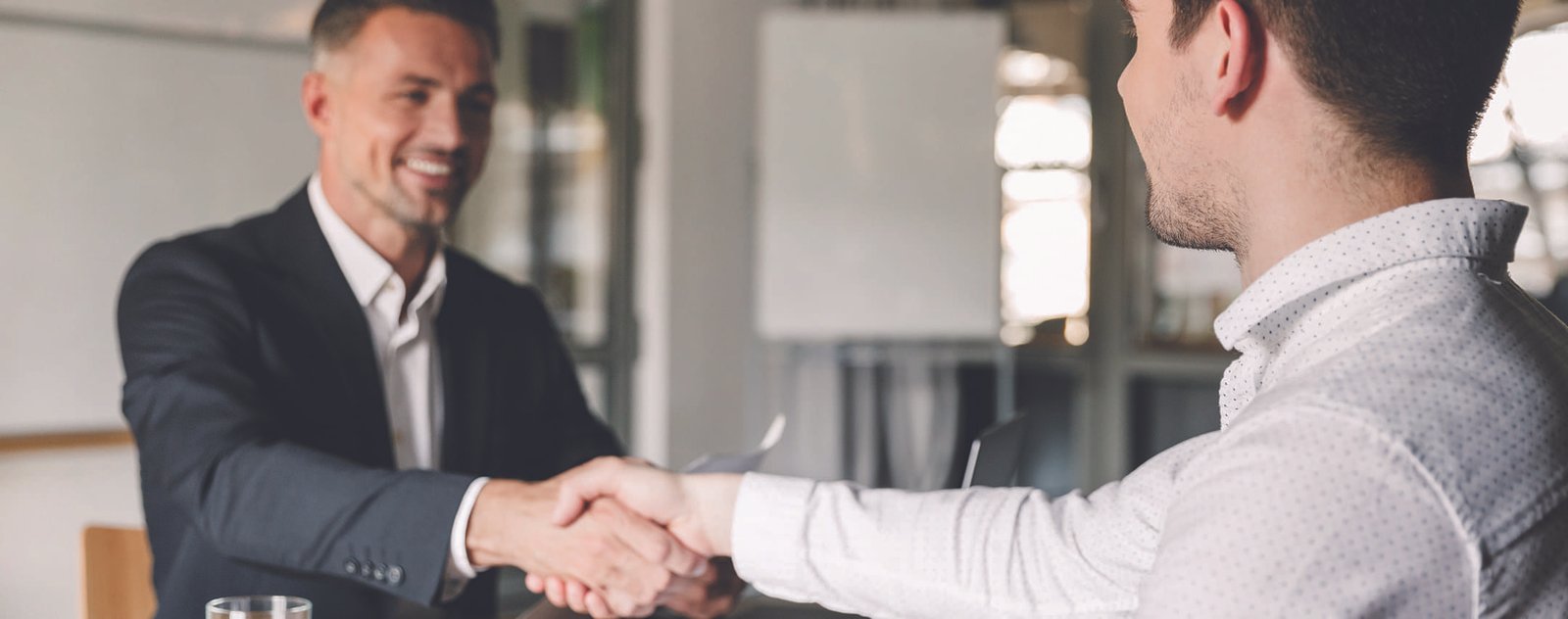 two gentleman shaking hands