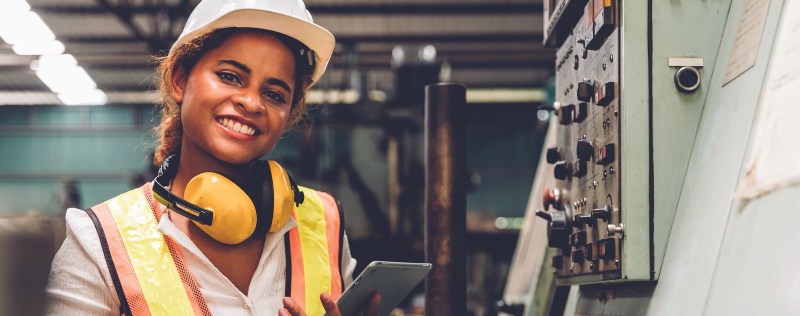 materials complaint processing | close up of a woman smiling inside of a warehouse